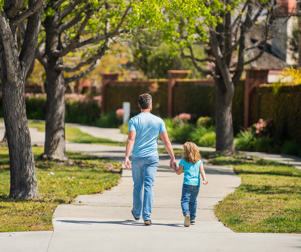 dad and daughter walking