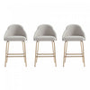 Tabouret de comptoir moderne en metal Gracie avec revetement en tissu, gris pierre et or - Lot de 3