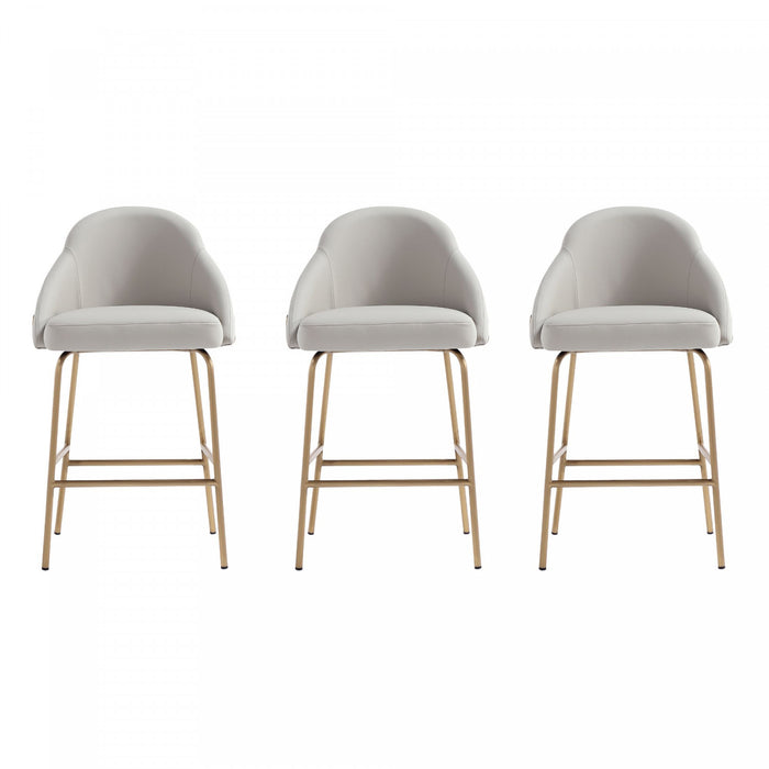 Tabouret de comptoir moderne en metal Gracie avec revetement en tissu, gris pierre et or - Lot de 3