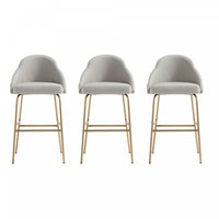 Tabouret de bar moderne en metal Gracie avec revetement en tissu, gris pierre et or - Lot de 3