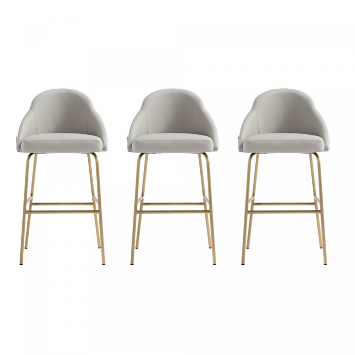 Tabouret de bar moderne en metal Gracie avec revetement en tissu, gris pierre et or - Lot de 3