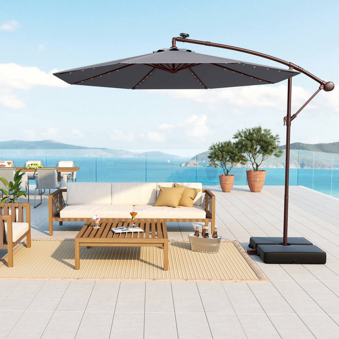 Parasol deporte suspendu Costway 10 pieds avec 32 LED, sac de sable, base croisee exterieure gris fonce