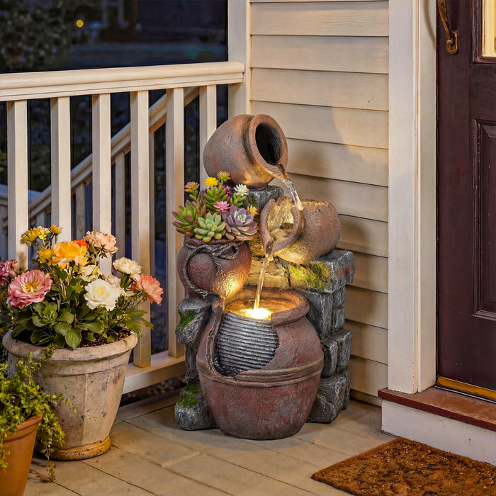 Fontaine exterieure Outsunny avec lumieres LED et cascade rocheuse