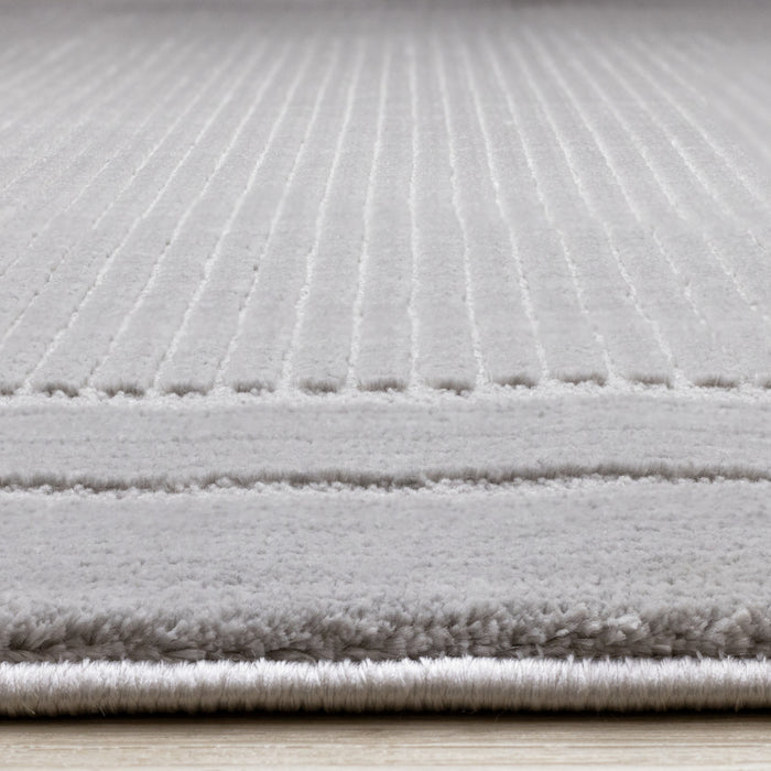 Carpette à poil long et court Ellie en polyester doux texturé à bordure grise - 5 pi 3 po x 7 pi 7 po