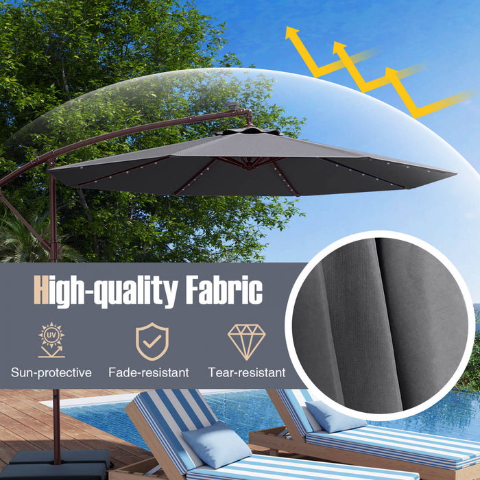 Parasol deporte suspendu Costway 10 pieds avec 32 LED, sac de sable, base croisee exterieure gris fonce