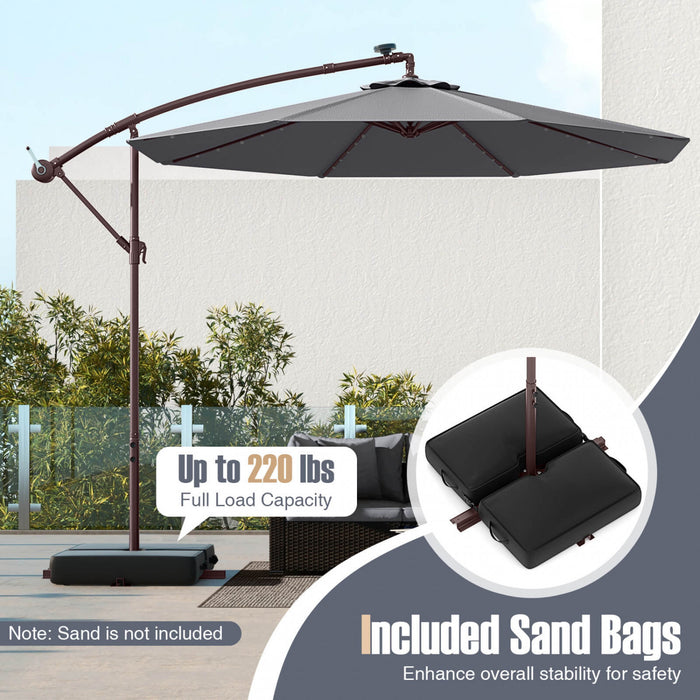 Parasol deporte suspendu Costway 10 pieds avec 32 LED, sac de sable, base croisee exterieure gris fonce