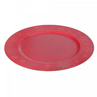 Assiette de présentation rouge ornée de flocons de neige
