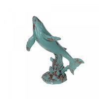 Figurine en polyrésine turquoise d’une baleine nageant vers le haut
