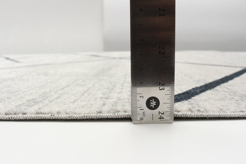 Carpette Damali ivoire et bleue lavable à la machine - 5 pi 0 po x 7 pi 0 po