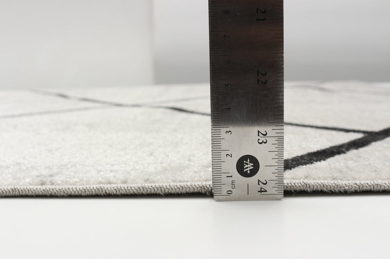 Carpette Damali ivoire et noire lavable à la machine - 8 pi 0 po x 10 pi 0 po
