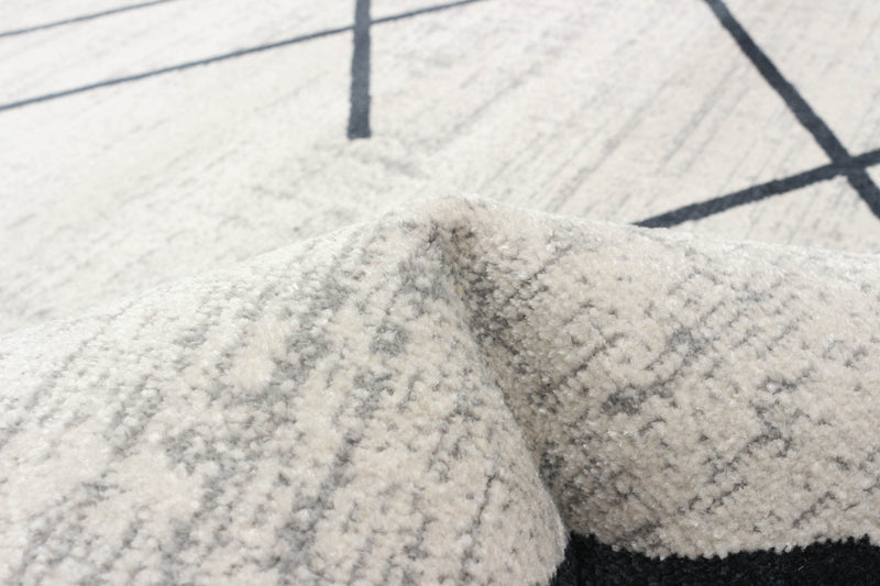 Carpette Damali ivoire et bleue lavable à la machine - 5 pi 0 po x 7 pi 0 po