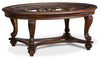 Table à café ovale traditionnelle Valencia de 48 po avec dessus en verre - bois brun foncé avec touches de filigrane