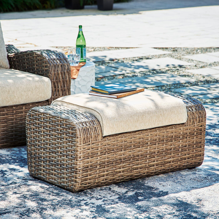 Grand pouf Cali pour la terrasse à l’extérieur - osier en résine et tissu Nuvella, résistant aux rayons UV et aux intempéries - brun et beige