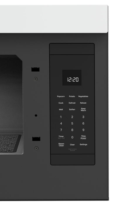 Four à micro-ondes à hotte intégrée Whirlpool de 1,1 pi³ à installation affleurée avec cuisson à 900 W - blanc - YWMMF5930PW