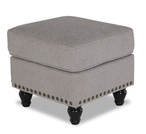 Pouf Wynn de 24 po fabriqué au Canada en tissu de chenille avec bordure de clous décoratifs et pattes en oignon en bois - taupe